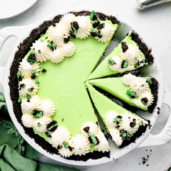 a green pie with a slice taken out of it.