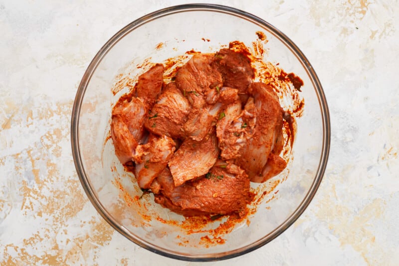 a glass bowl with meat in it.