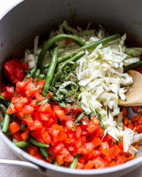 ingredients for cabbage soup in a dutch oven.