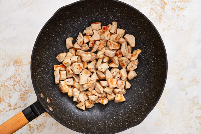 fried chicken in a frying pan.