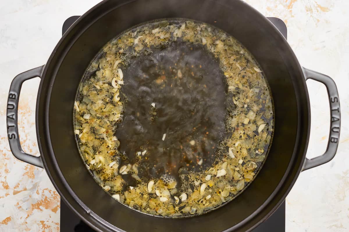 Deglazing the pan of onion and garlic.
