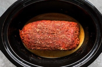 a piece of meat in a crock pot.