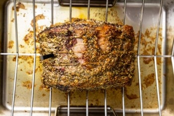 a roasting rack with a piece of meat in it.