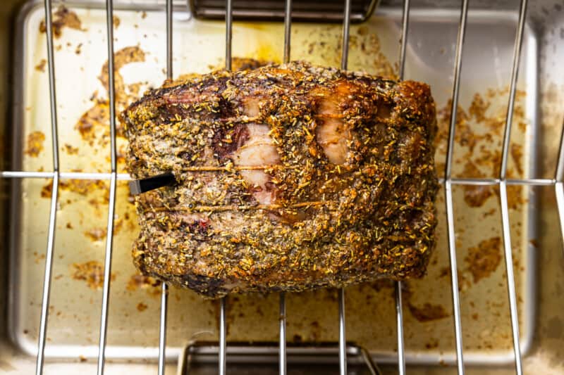 a roasting rack with a piece of meat in it.