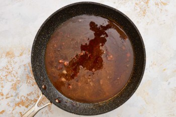 a frying pan with a sauce in it.