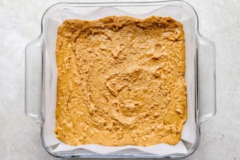 a glass baking dish filled with peanut butter.