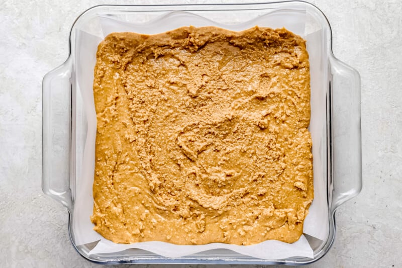 a glass baking dish filled with peanut butter.