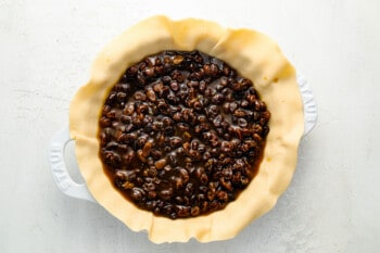 a pie crust filled with raisins and nuts.