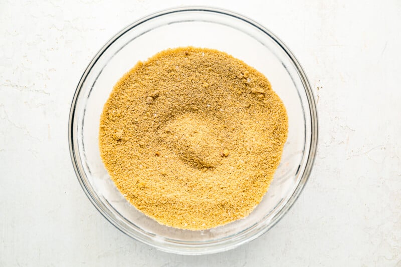 a glass bowl filled with a mixture of brown sugar and cinnamon.