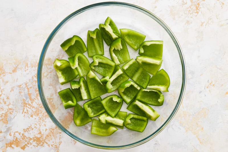 chopped green peppers in a glass bowl.