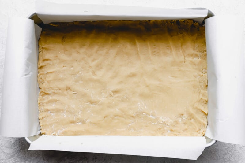 a square of dough in a baking pan.