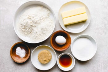 the ingredients for a recipe for buttermilk pancakes, including flour, sugar, eggs and butter.