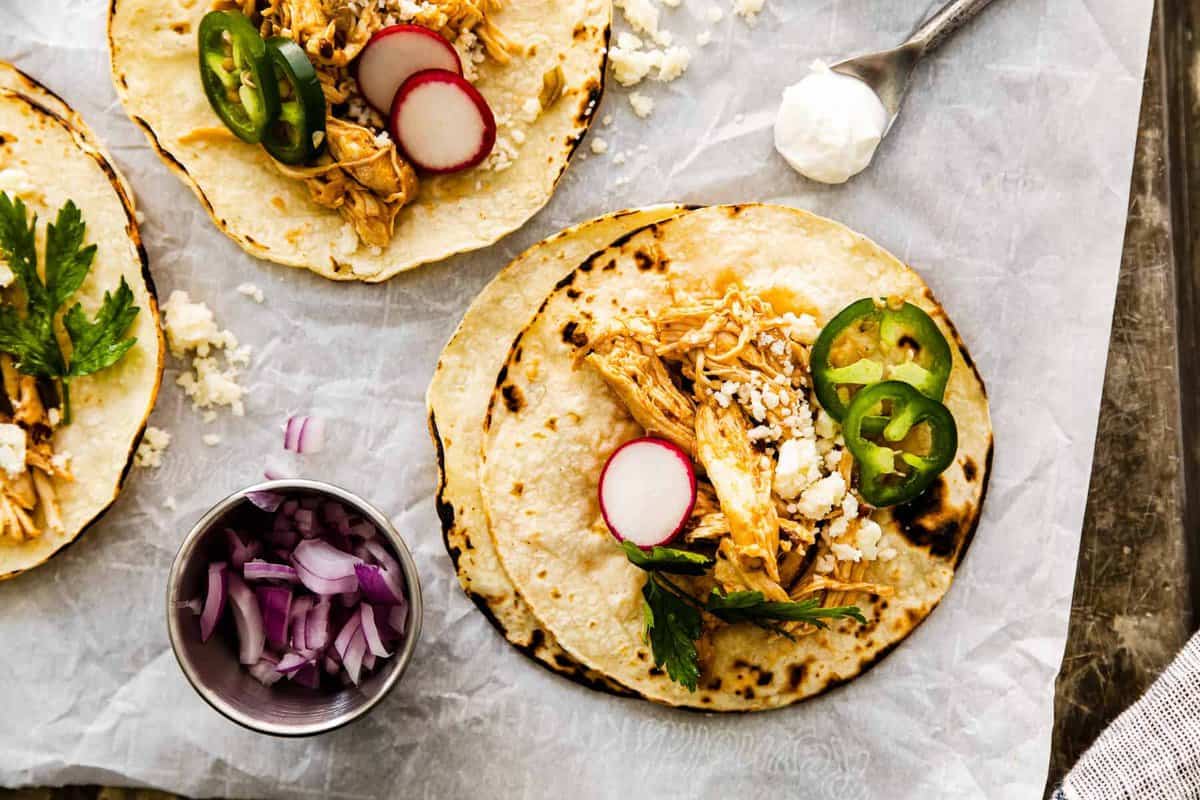 instant pot shredded chicken tacos on baking sheet
