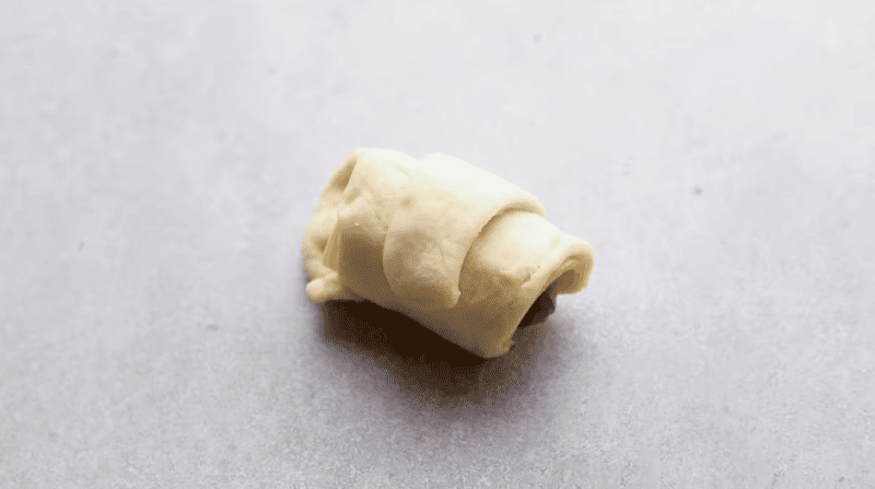 a cheese and sausage stuffed crescent roll.