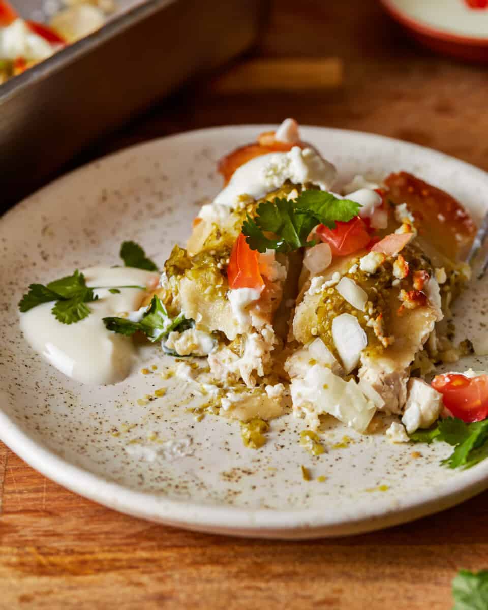 mexican enchiladas on a white plate.