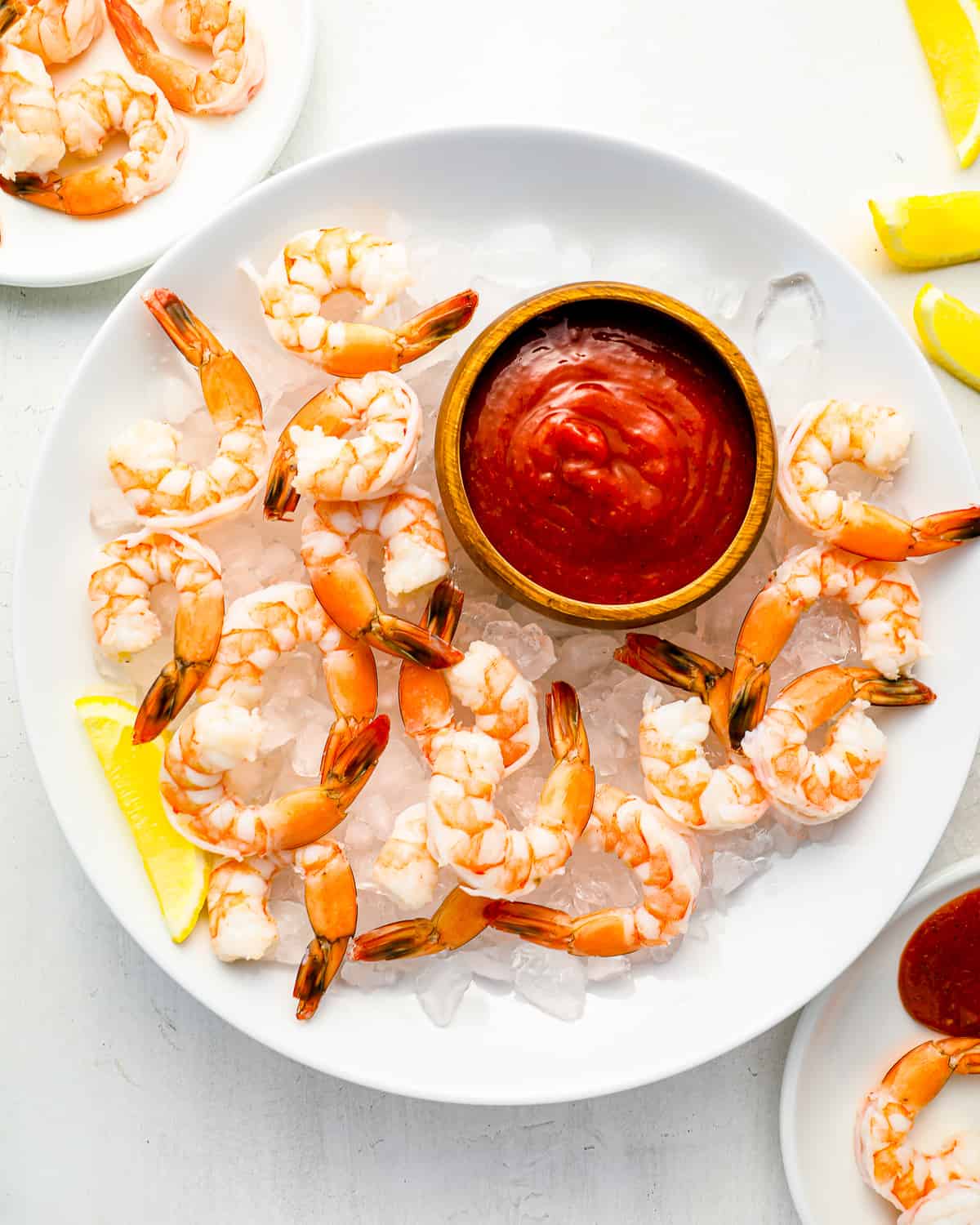 shrimp on ice with cocktail sauce.