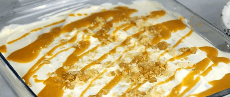 Better than sex cake with a whipped cream topping with caramel bits.