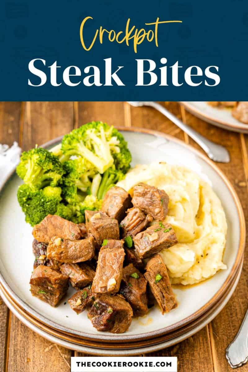 Crockpot steak bites on a plate with broccoli and mashed potatoes.