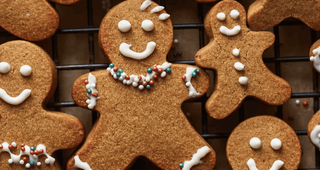 Gingerbread cookies on a cooling rack.