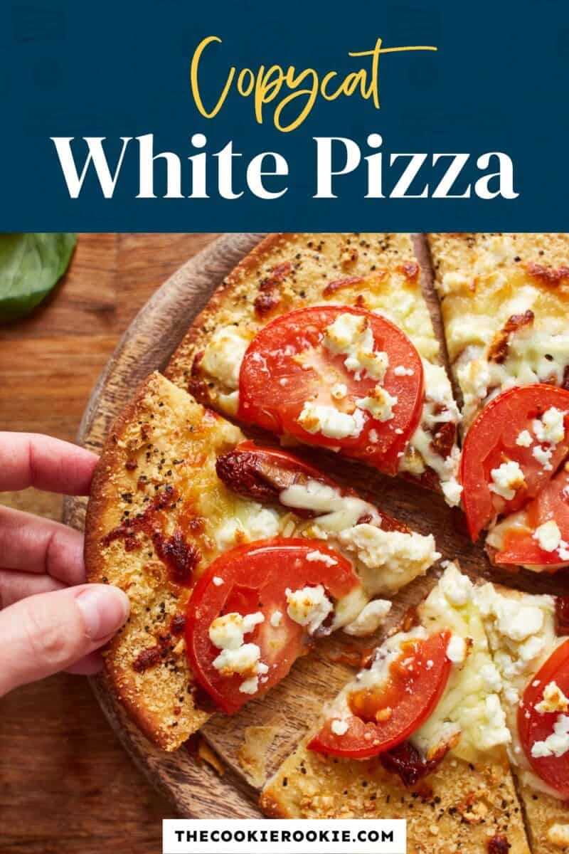 A white pizza on a wooden board with the text'cupcake white pizza'.