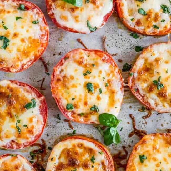BAKED TOMATOES are a super quick and super easy side dish or appetizer for any occasion! These cheesy Baked Tomatoes with Mozzarella and Parmesan cheese are so simple yet incredibly delicious. They are always a hit when we make them and get eaten right away. These Baked Parmesan Tomatoes are just too tasty and fresh. 