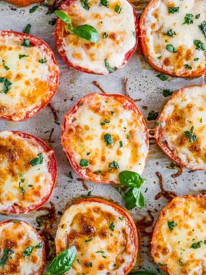 Cheesy Baked Tomatoes on parchment top down