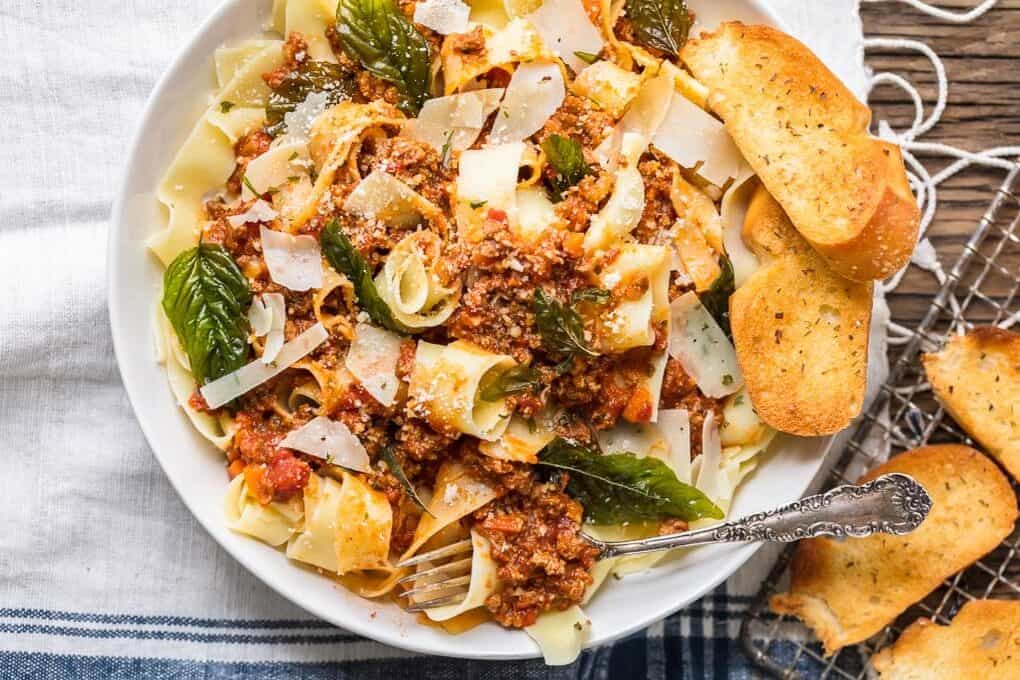 A plate of food, with Beef and noodles