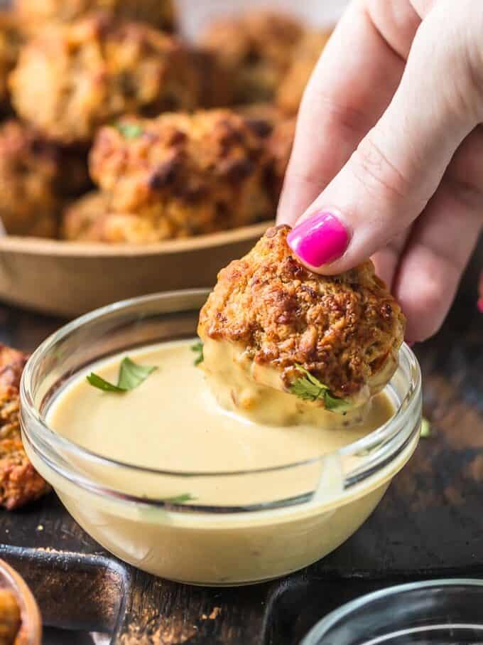 This classic Sausage Balls recipe is savory, cheesy, and tasty! These Bisquick sausage balls are the perfect appetizer for holidays or game day. Serve them with apricot sweet chili dipping sauce! Dip for sausage balls