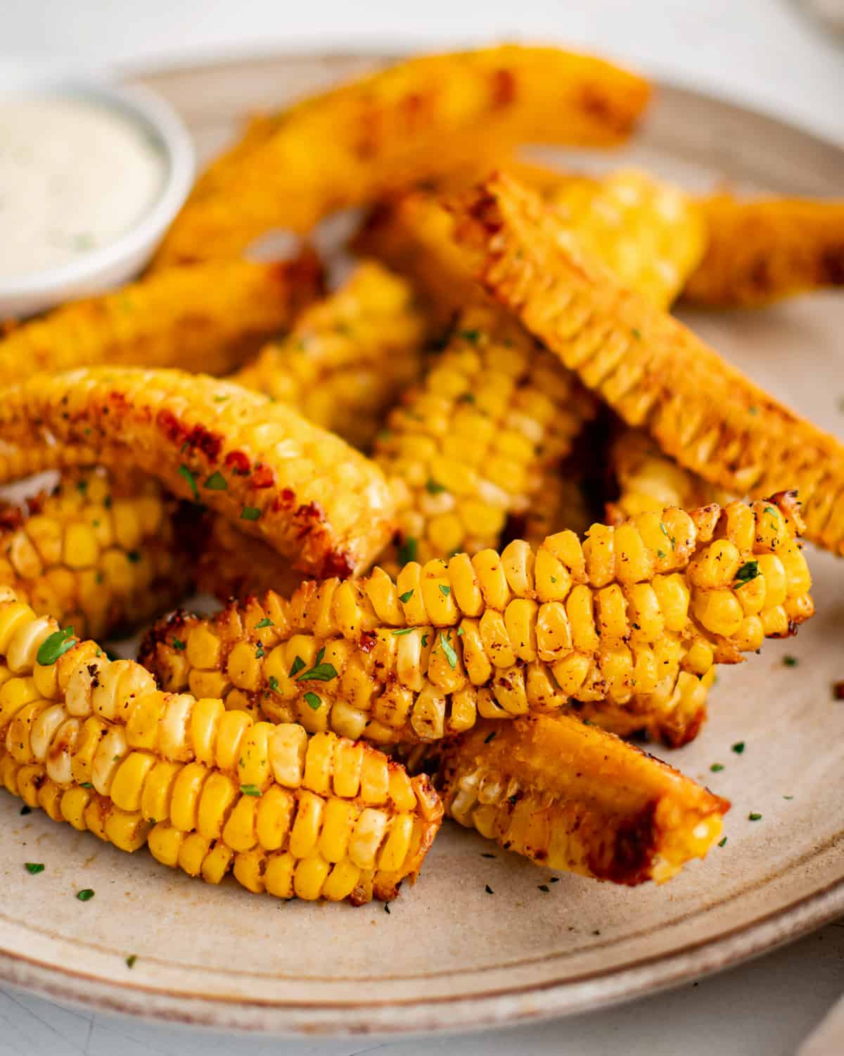 baked corn ribs with dipping sauce.