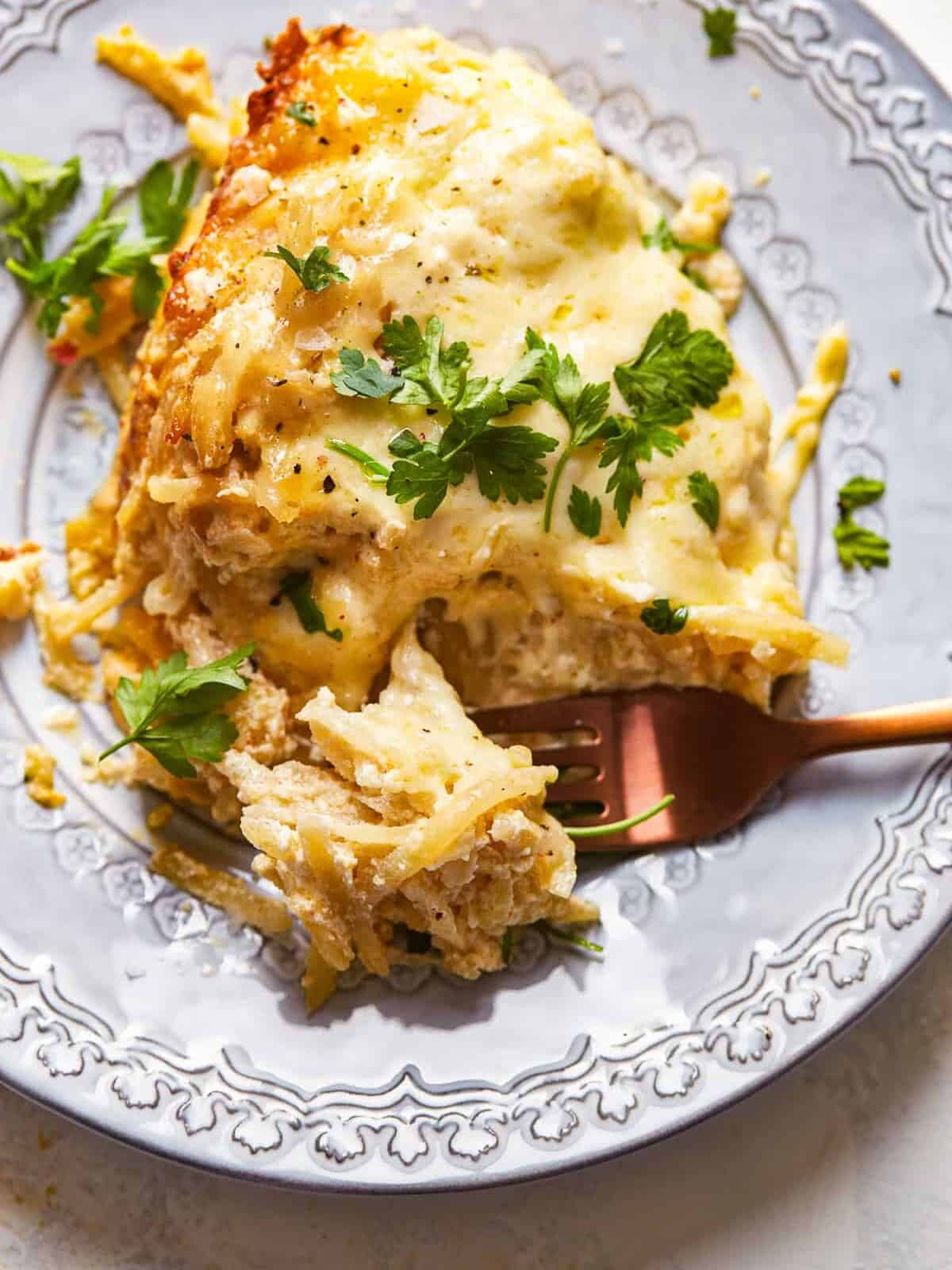 fork in cheesy potato casserole
