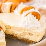 A slice of banana cheesecake on a plate.