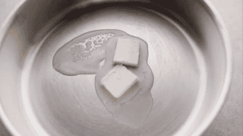 melting 2 tablespoons of butter in a pan.