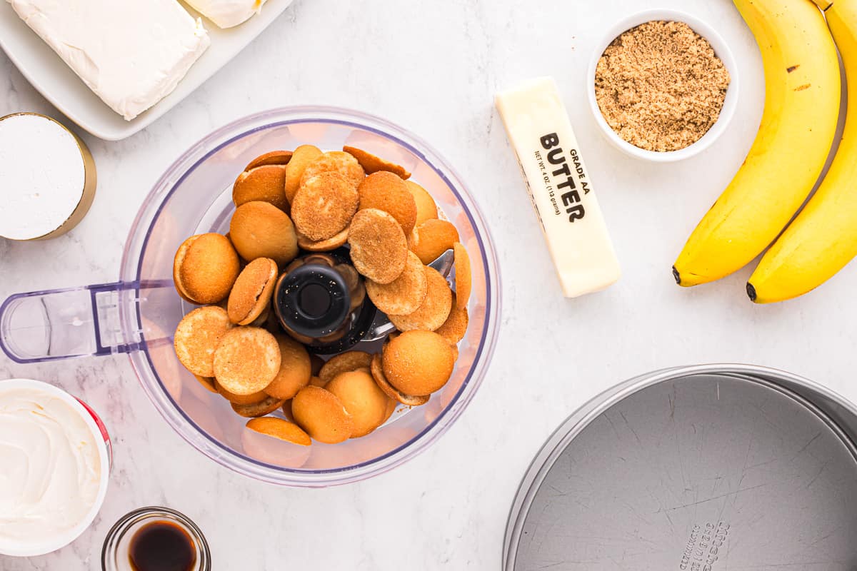 A food processor filled with bananas and other ingredients.