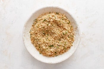 A bowl filled with a mixture of herbs and spices.