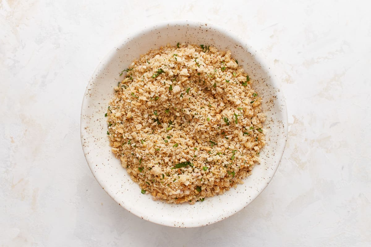 A bowl filled with the breadcrumb mixture. 