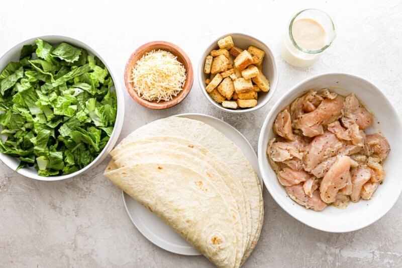 Chicken quesadilla ingredients on a white table.