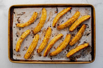 Corn ribs arranged on a baking sheet.