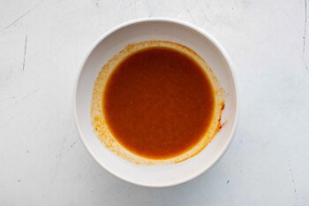 A bowl of corn sauce on a table.