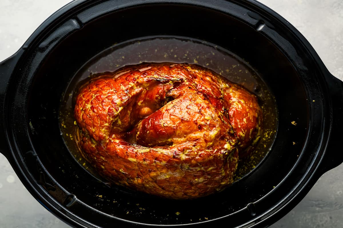 A roasted chicken in a slow cooker.