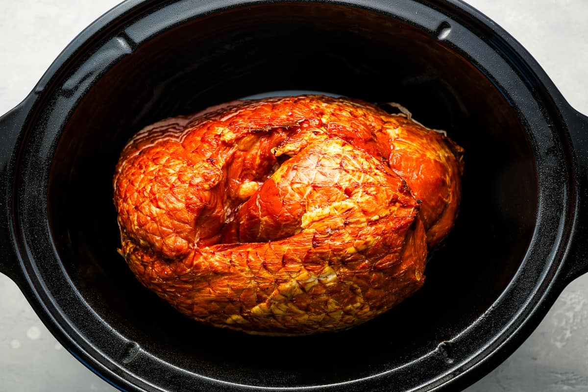 A roasted turkey in a crock pot.