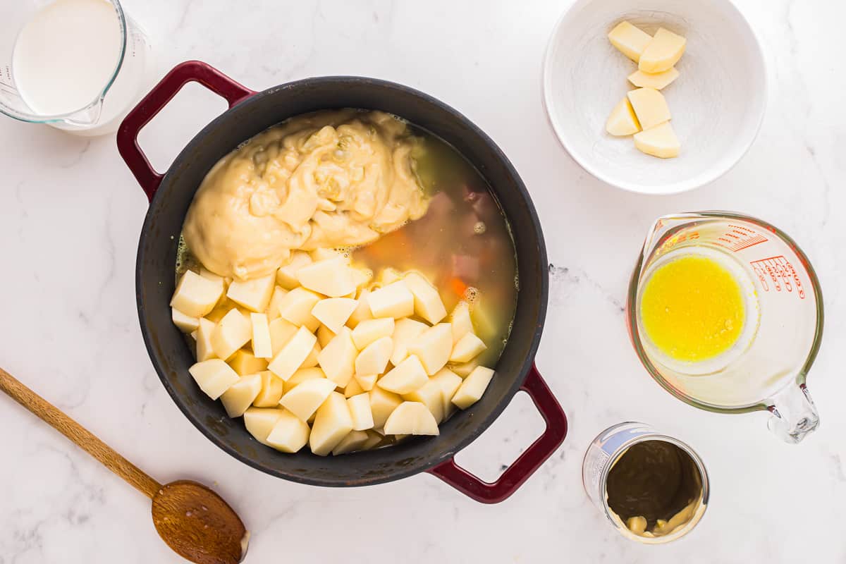 A pan with potatoes, eggs, milk and other ingredients.