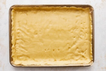 A square of dough in a baking pan.