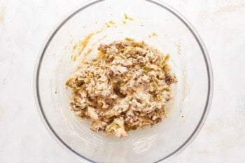 A bowl filled with a mixture of meat and vegetables.