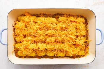 A casserole dish filled with cheesy potato rolls.
