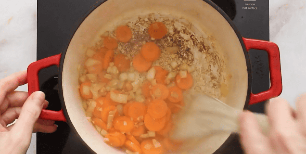 Cooking onion, garlic and carrots. 