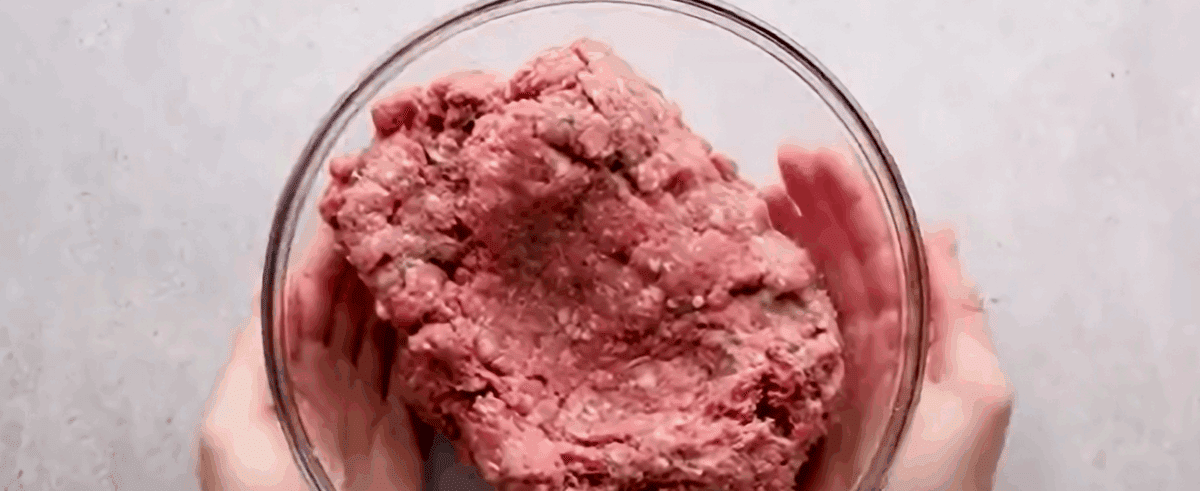 Ground beef mixture in a glass bowl.