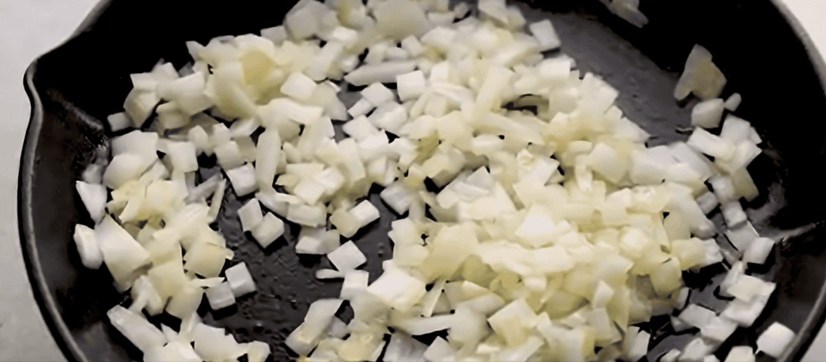 Cooking the onions in a skillet.