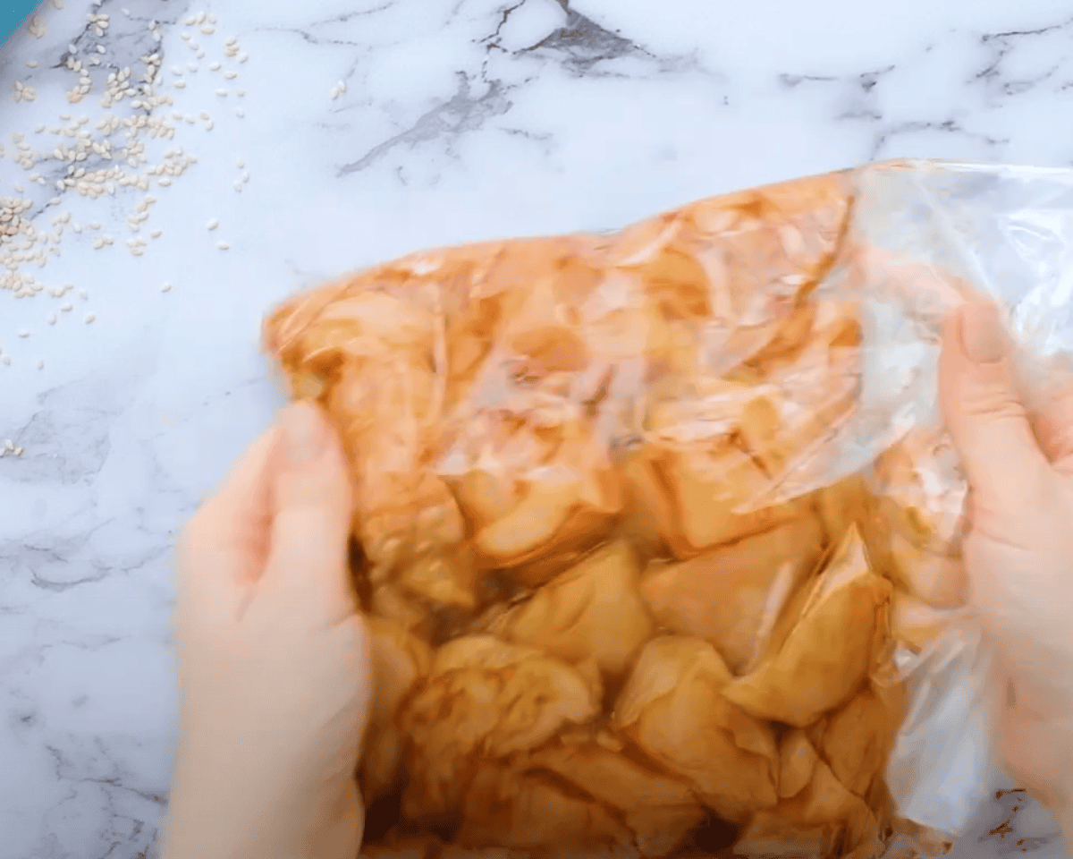 Cubed chicken with the marinade in a Ziplock bag. - 7