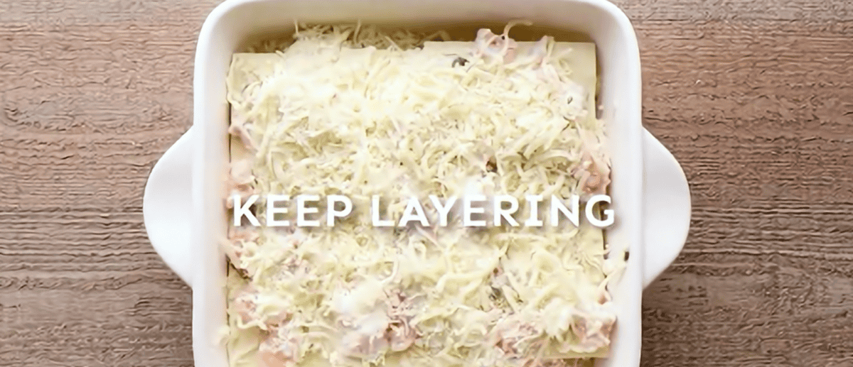 Layering all the lasagna ingredients. 
