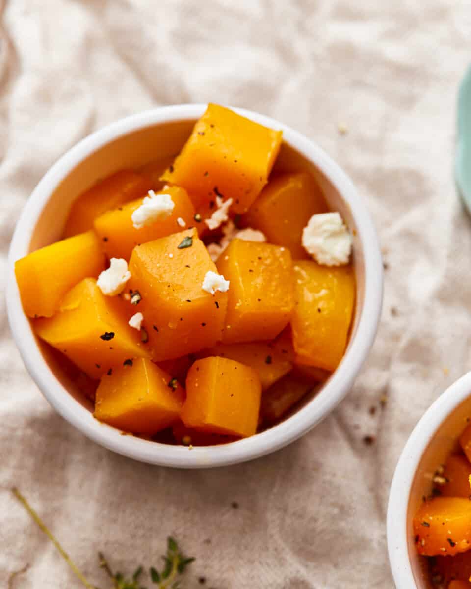 two bowls of butternut squash with feta.